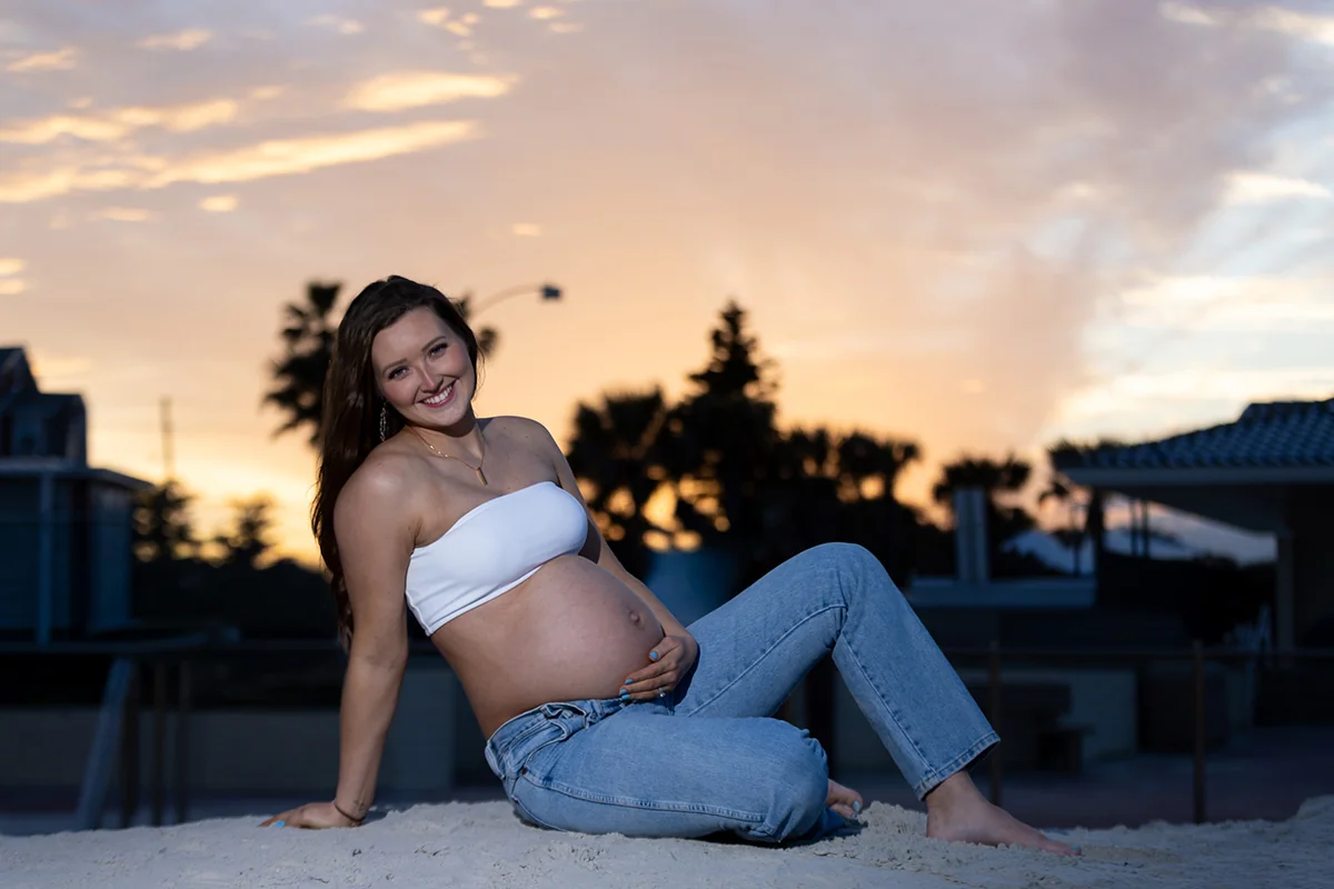 Pregnant woman photographed at sunset by Rose Rock Productions